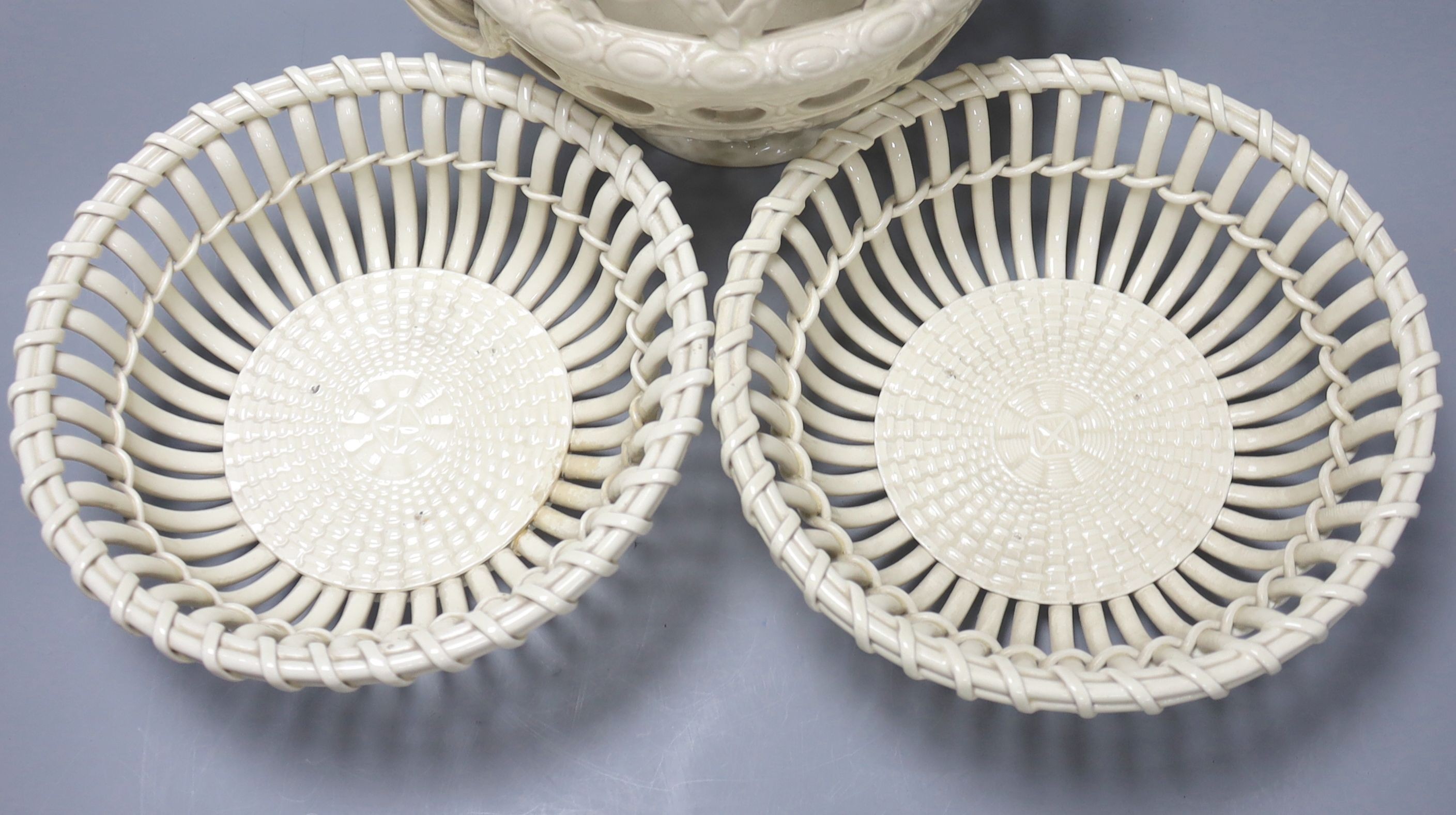 A Victorian Wedgwood creamware covered basket and two Continental creamware baskets, 22cm